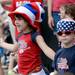 Lily, Stabenow, 5, and her brother Walter, 3, both of Hamburg Township, watch the end of the 23rd Annual Ann Arbor Jaycees Fourth of July Parade on Thursday, July 4, 2013 on South State Street in downtown Ann Arbor. Melanie Maxwell | AnnArbor.com